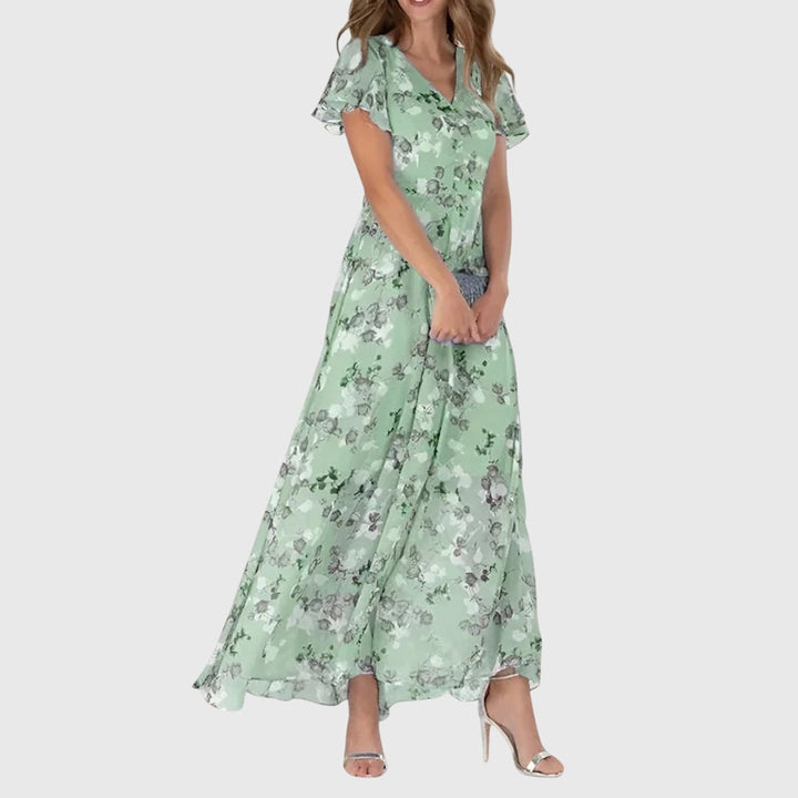 Stylish women's floral V-neck maxi dress with flutter sleeves, great for elegant spring occasions or comfortable summer wear.