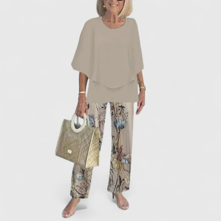 Women's elegant floral print two-piece set with wide leg trousers for a chic summer look.