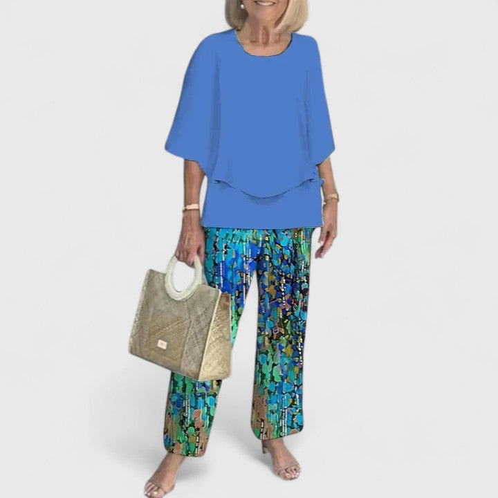 Versatile women's floral print two-piece set; elegant layered top & wide leg trousers for various occasions.