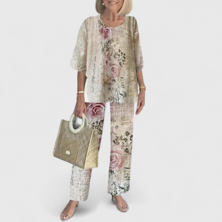 Essential women's summer fashion: elegant floral print two-piece set with wide leg trousers.
