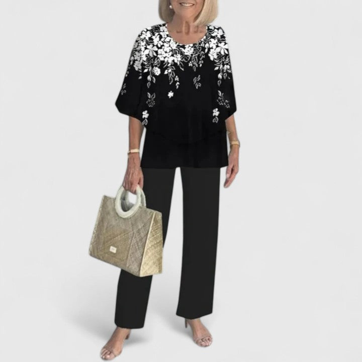 Garden party ready women's floral print two-piece set with elegant layered top & wide leg trousers.