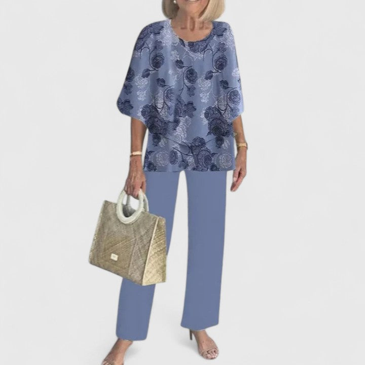 Vibrant floral print women's two-piece set: layered top & elegant wide leg trousers, summer style.
