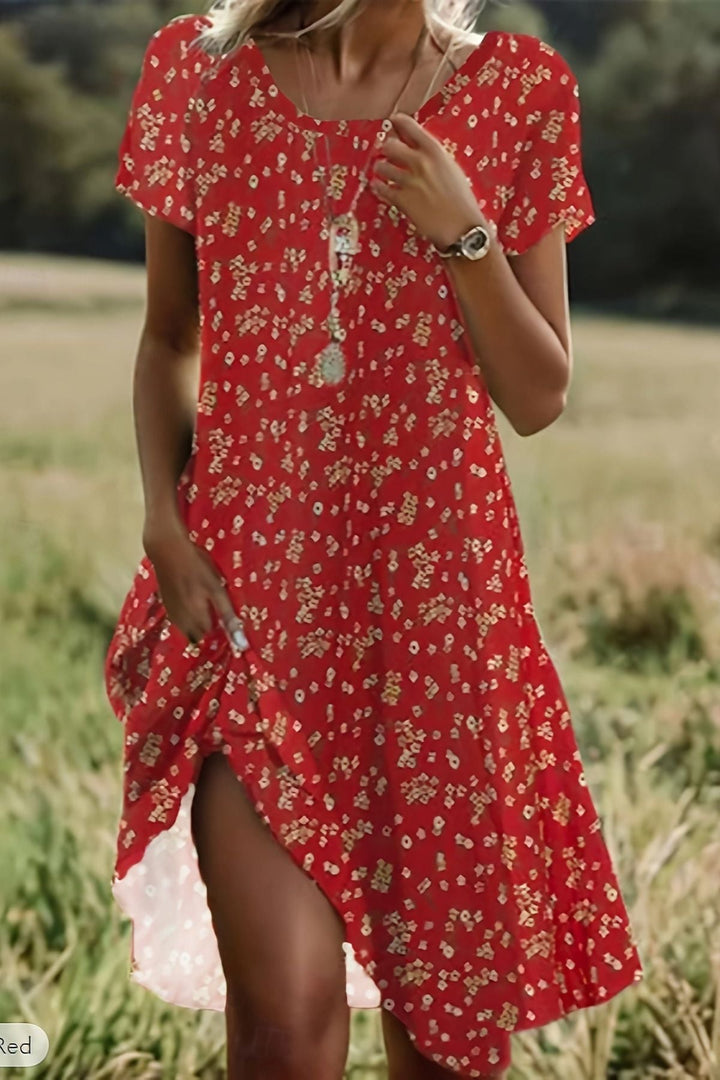 Women's elegant flowing midi dress in a sophisticated style, perfect for versatile day to evening wear.