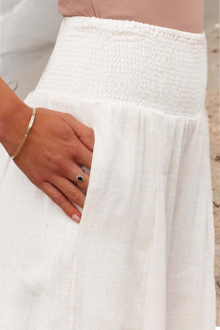 Elegant women's palazzo pants, flowy boho design. Comfortable wide-leg for summer casual & beachwear.