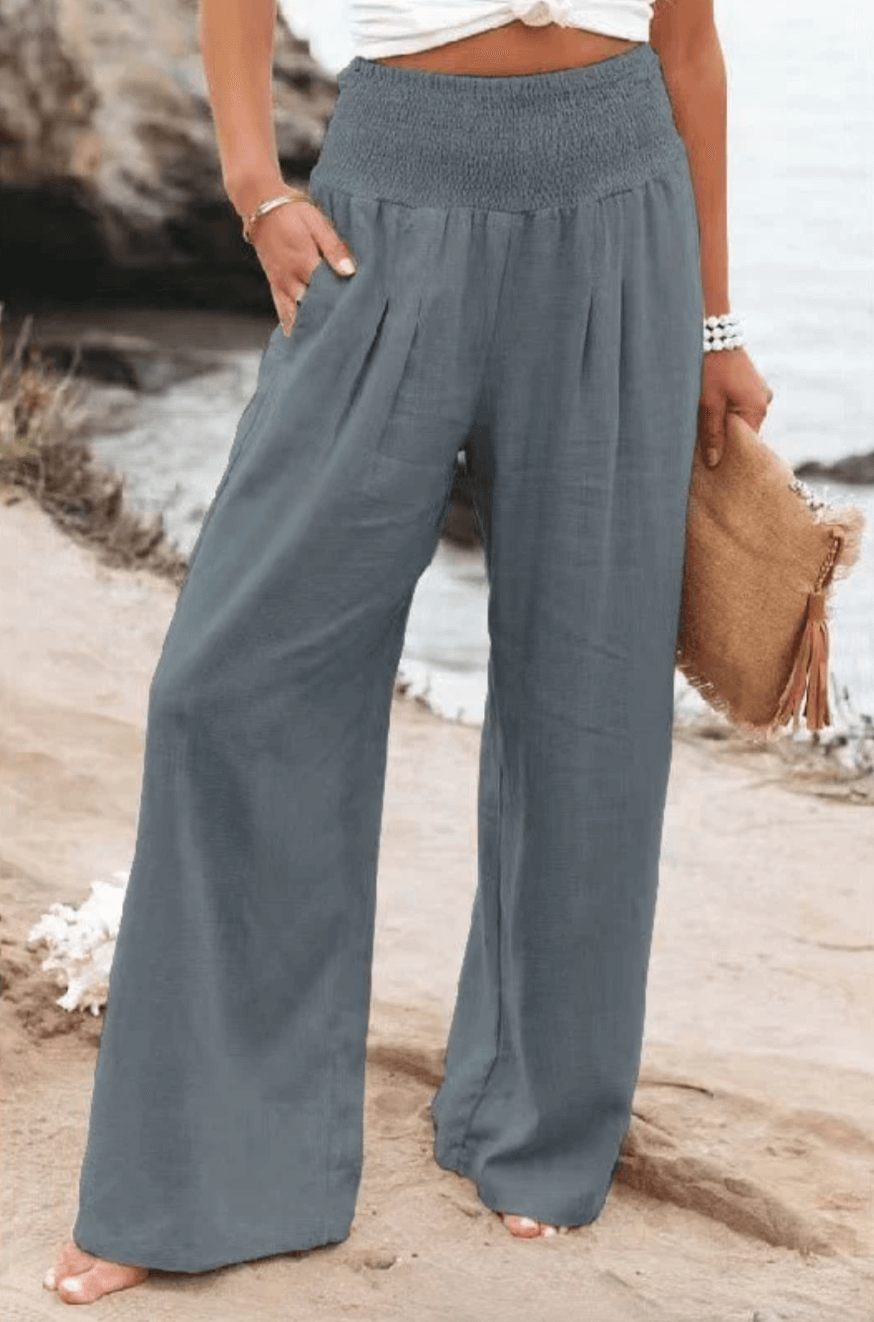 Beachwear women's palazzo pants, boho flowy. Elegant wide-leg, high-waist, comfortable for summer style.