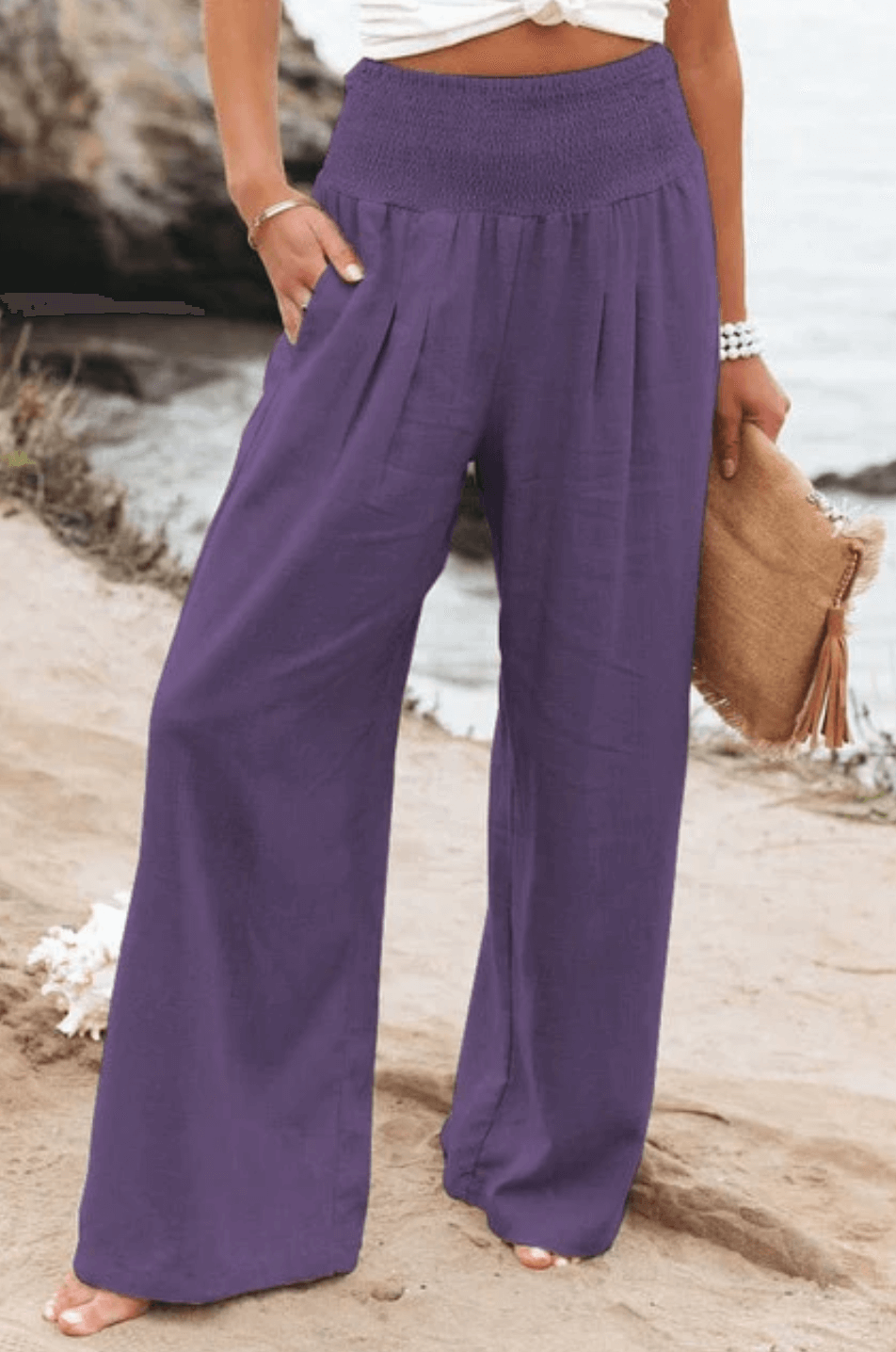 Flowy wide-leg palazzo pants for women, boho elegant. Comfortable summer beachwear, high-waist style.