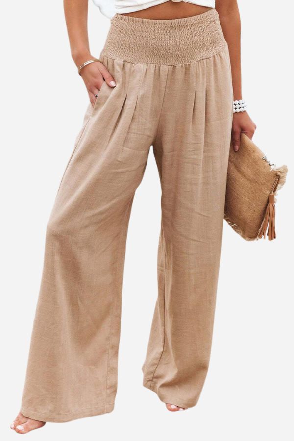 Elegant flowy palazzo pants for women, boho chic. High-waist wide-leg design for summer comfort.