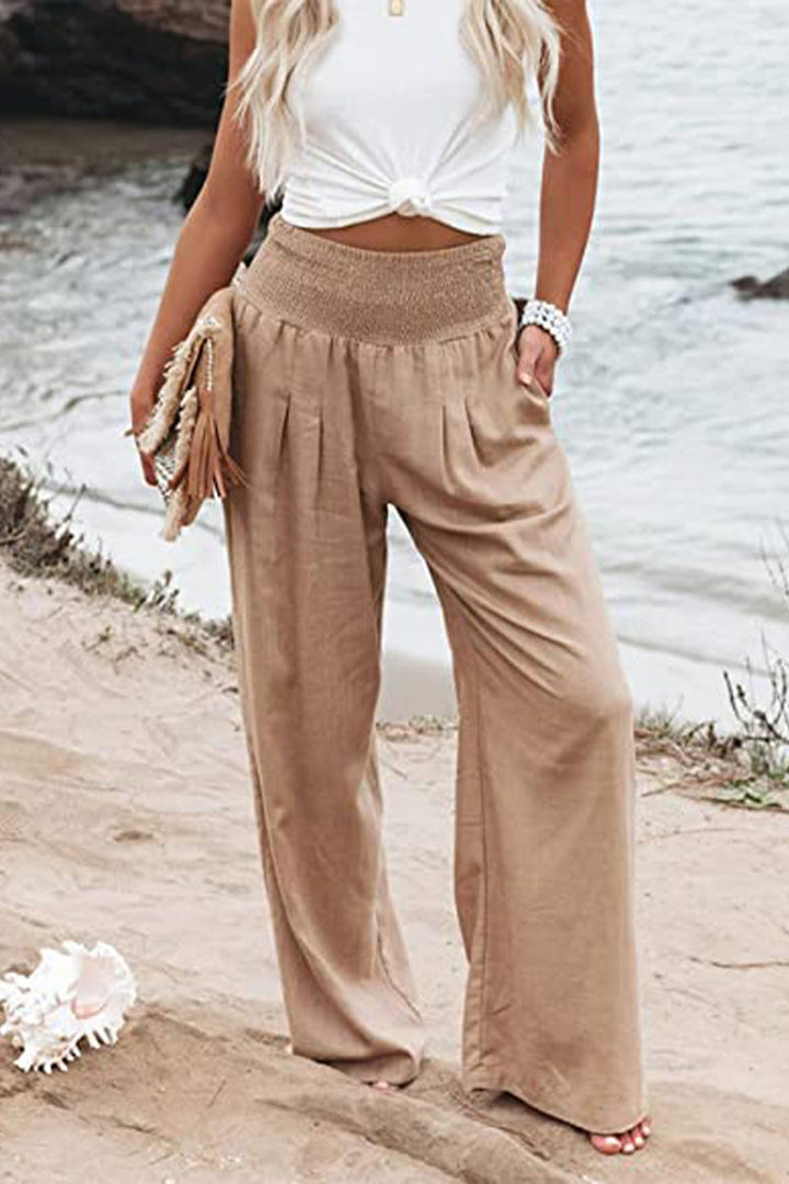 Women's comfortable flowy palazzo pants, boho elegant. Wide-leg summer beachwear, high-waist style.