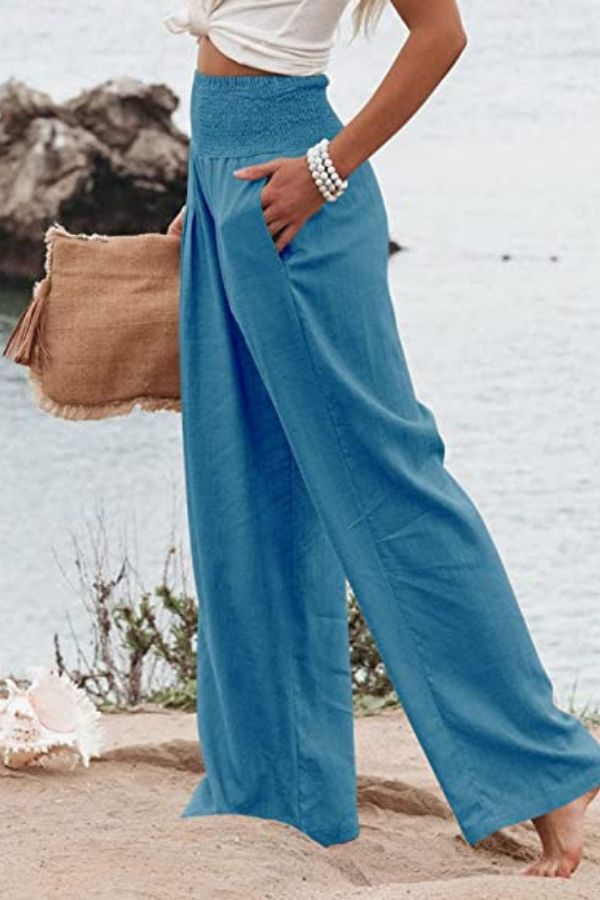 Women's high-waist flowy palazzo pants, boho elegance. Comfortable wide-leg summer beach & casual style.