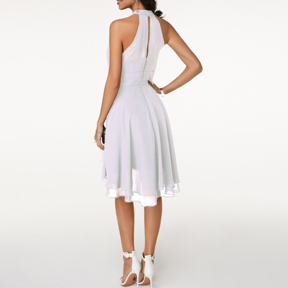 Sleeveless women's halter neck mini dress, ideal for cocktail parties and formal occasions. Stylish.