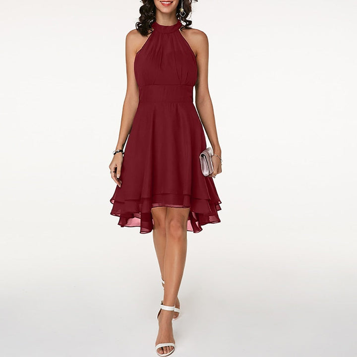 Modern women's layered hem mini dress with a sophisticated halter neck, ideal as a cocktail or party dress.