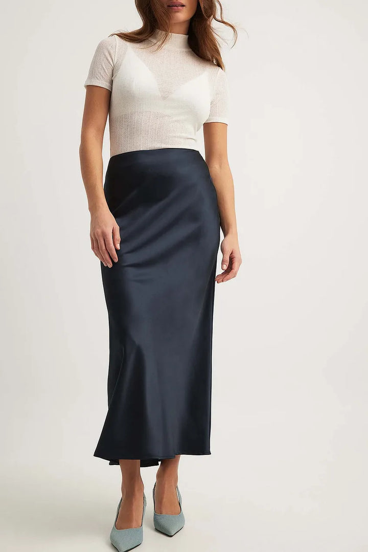 Women's elegant flowing midi skirt with a high waist, suitable for both formal and casual fashion apparel.