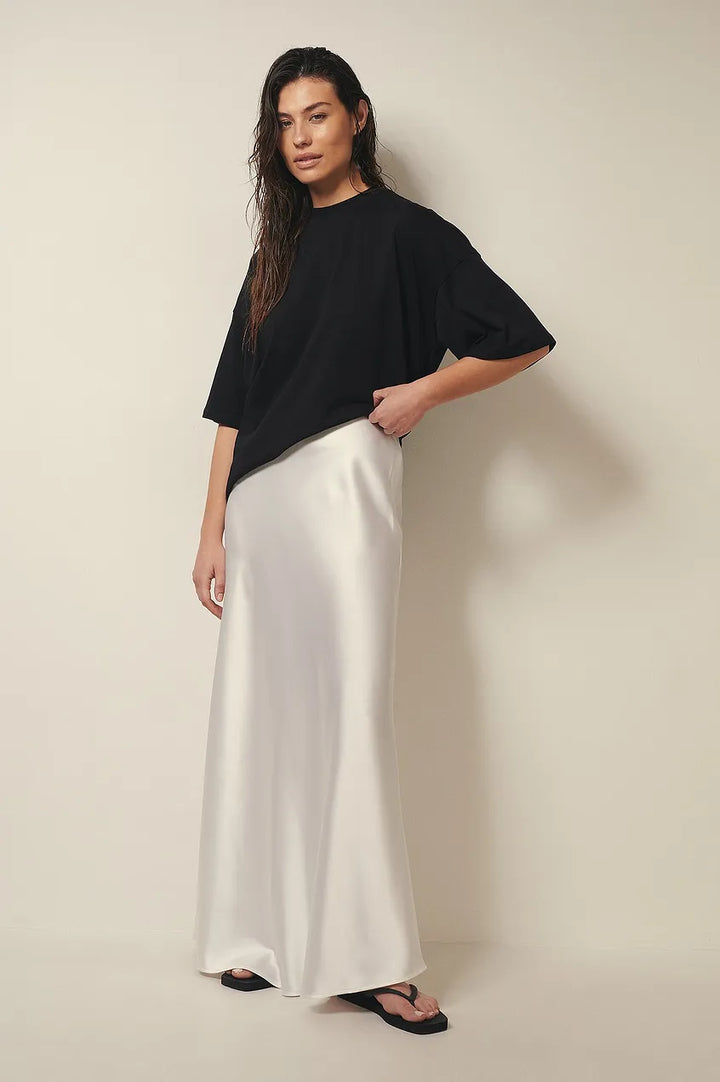 Stylish women's high-waisted flowing midi skirt, perfect for elegant formal occasions & versatile fashion.