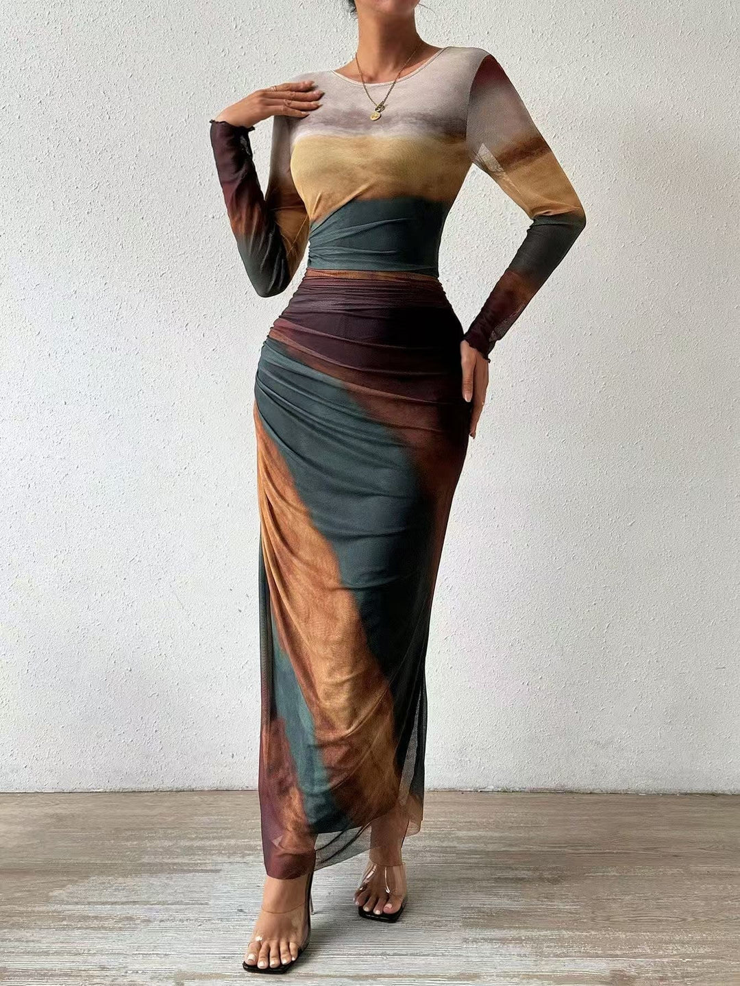 Stylish round neck long sleeve bodycon maxi dress for women, elegant & flattering silhouette.