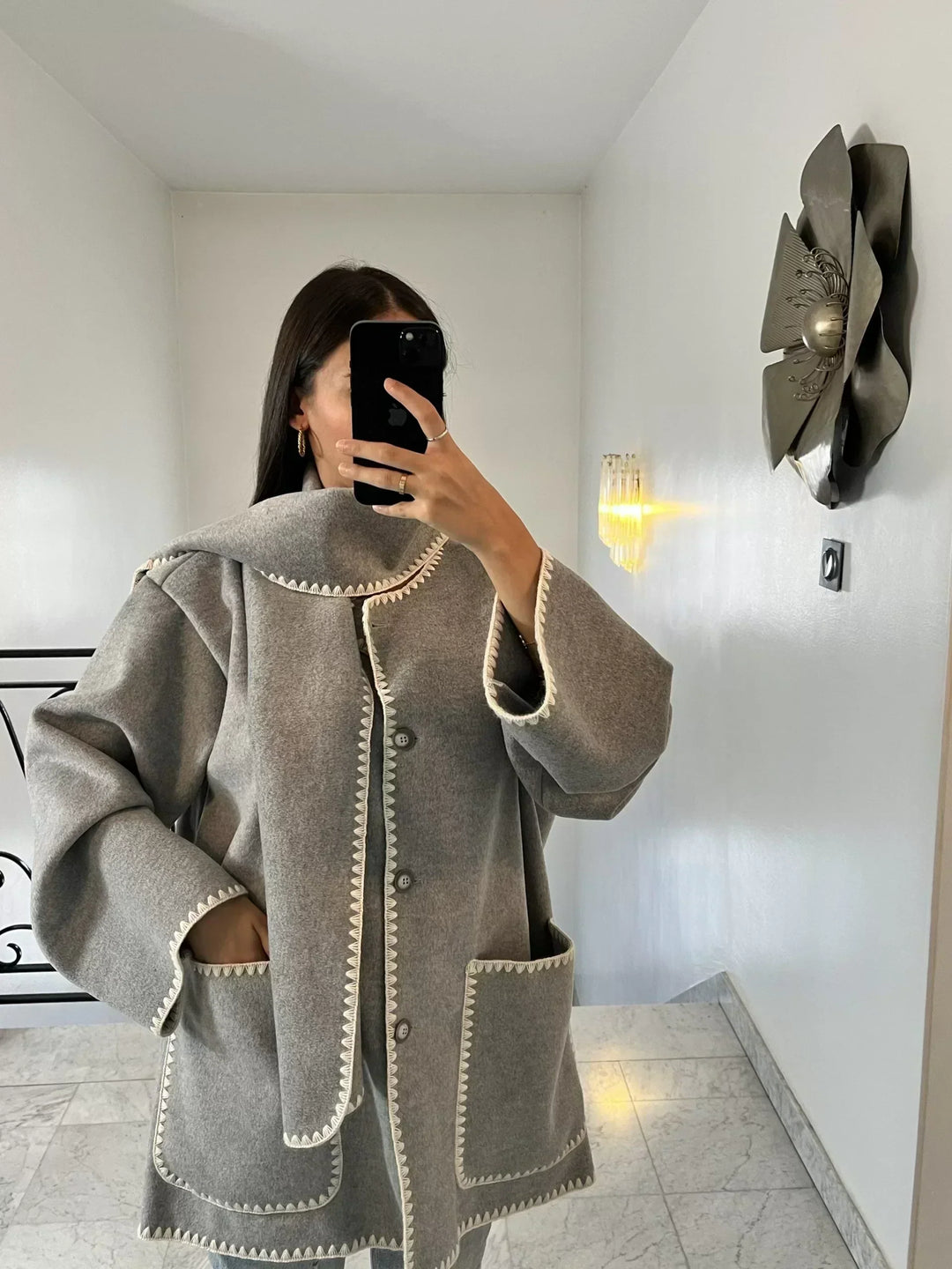 Stylish women's long fitted wool coat, an elegant choice for classic autumn fashion.