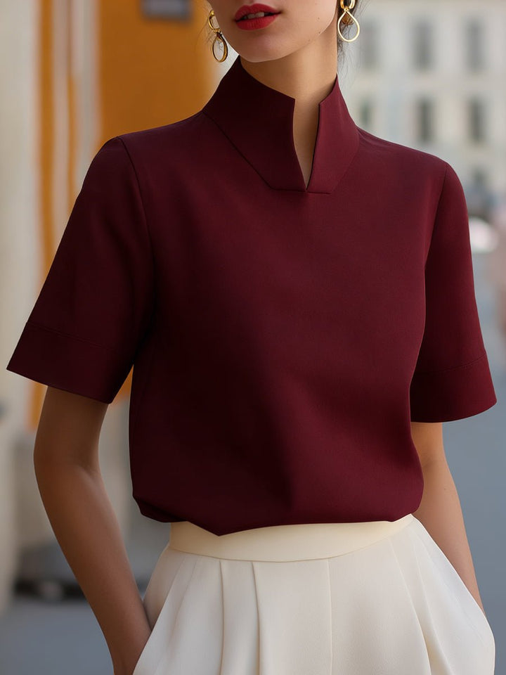 Stylish women's work blouse with mandarin collar, short sleeve, relaxed fit for professional elegance.