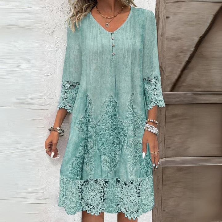 Versatile women's shift midi dress featuring elegant lace and three-quarter sleeves for comfortable everyday wear.