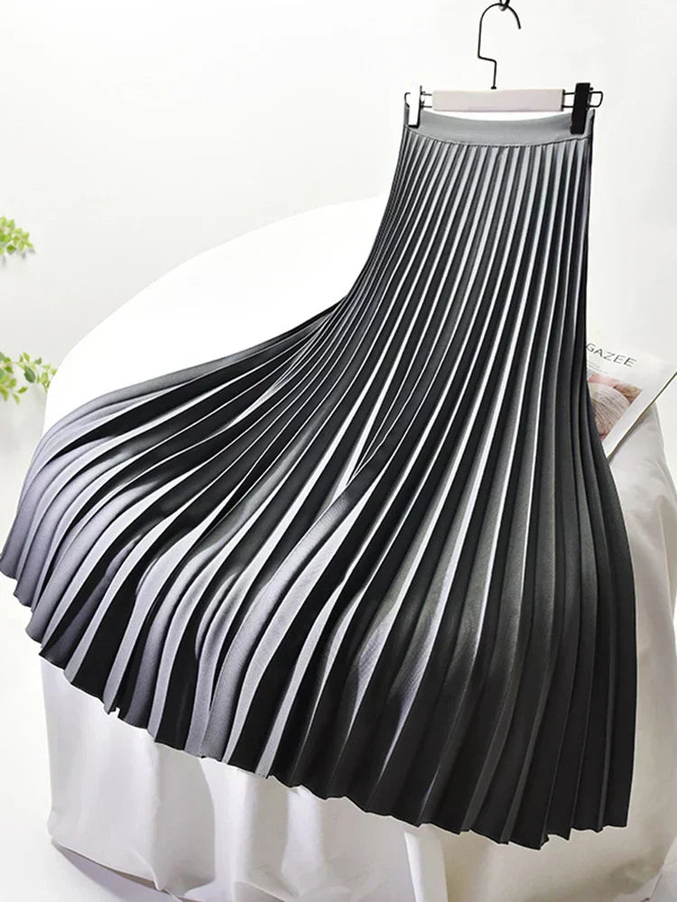 Close-up of the delicate pleating on a women's flowy maxi skirt, highlighting its elegant design.