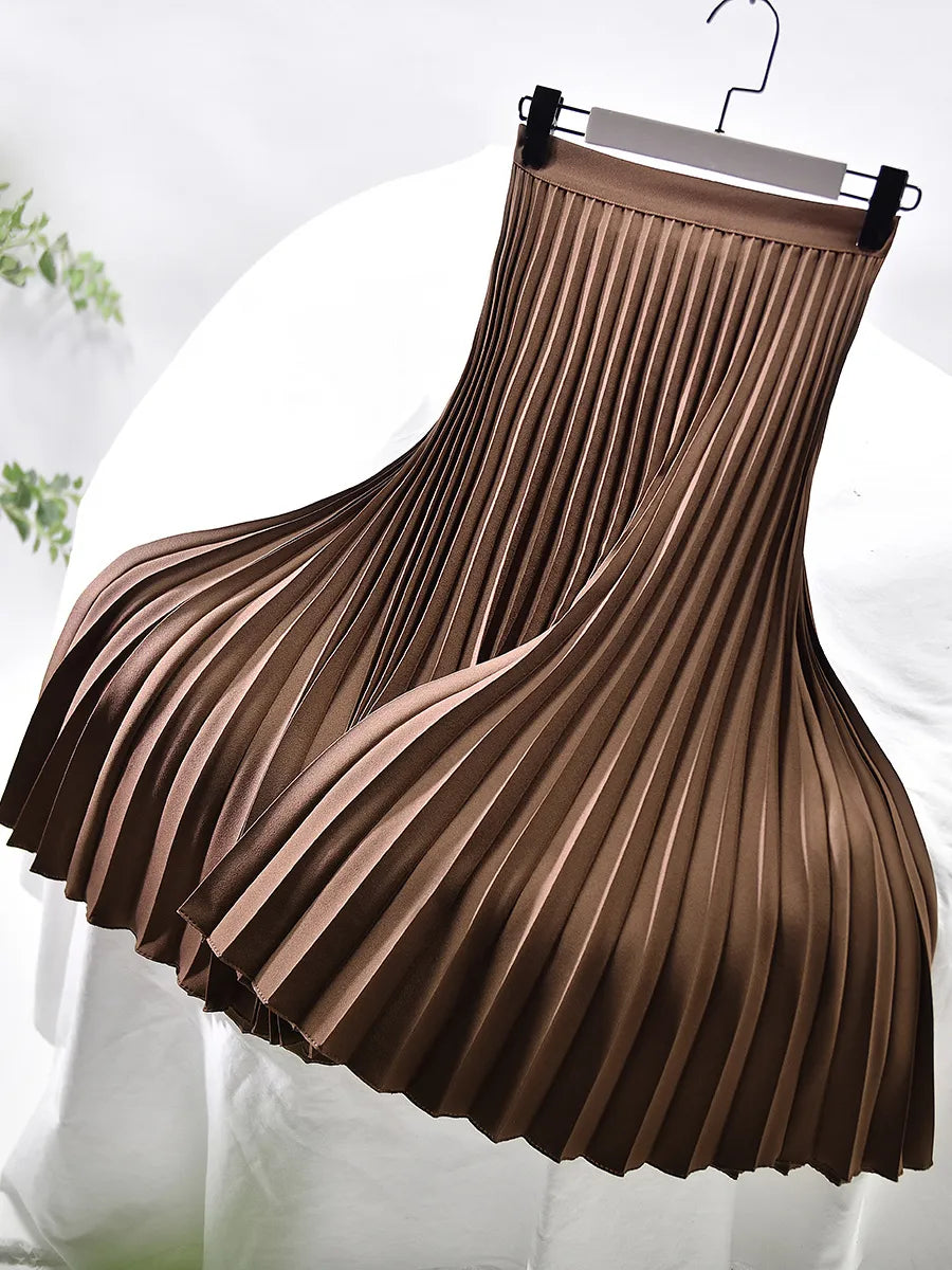 Full shot of a women's versatile pleated maxi skirt, showcasing its graceful flow and apparel.