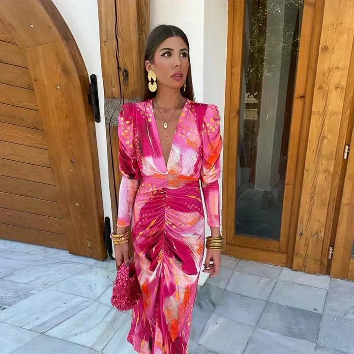 Women's elegant printed ruched midi wedding guest dress with V-neck, long sleeves, perfect for special occasions.