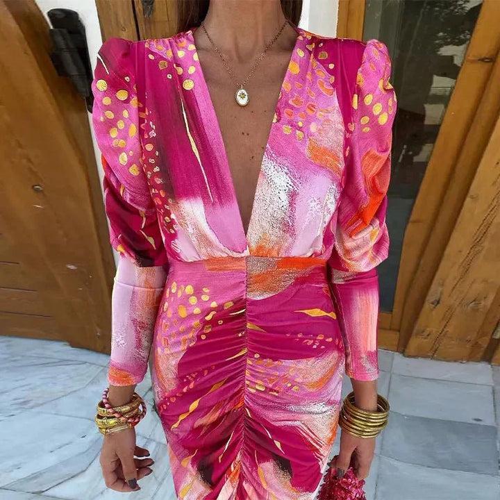 Sophisticated women's printed ruched midi dress, ideal as a wedding guest or cocktail party dress. Elegant and chic.