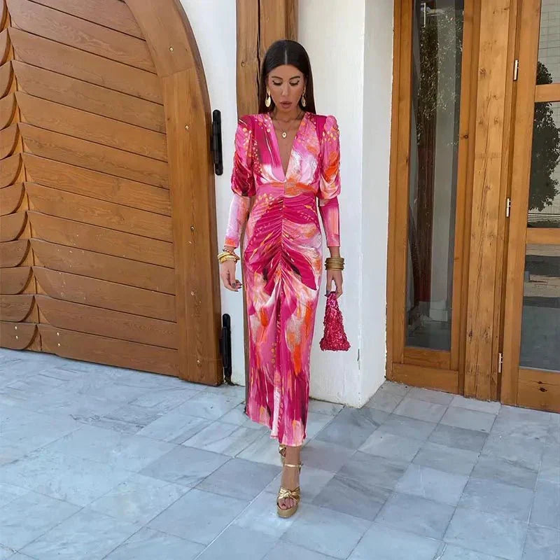 Chic women's printed ruched midi dress, perfect for wedding guests. Features elegant V-neck and long sleeves for parties.