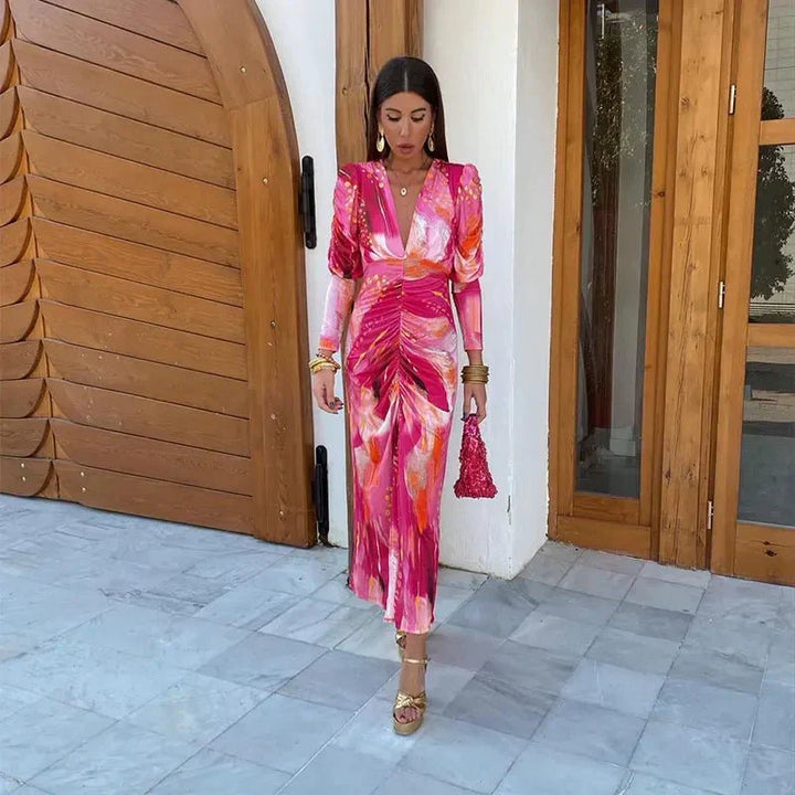 Chic women's printed ruched midi dress, perfect for wedding guests. Features elegant V-neck and long sleeves for parties.