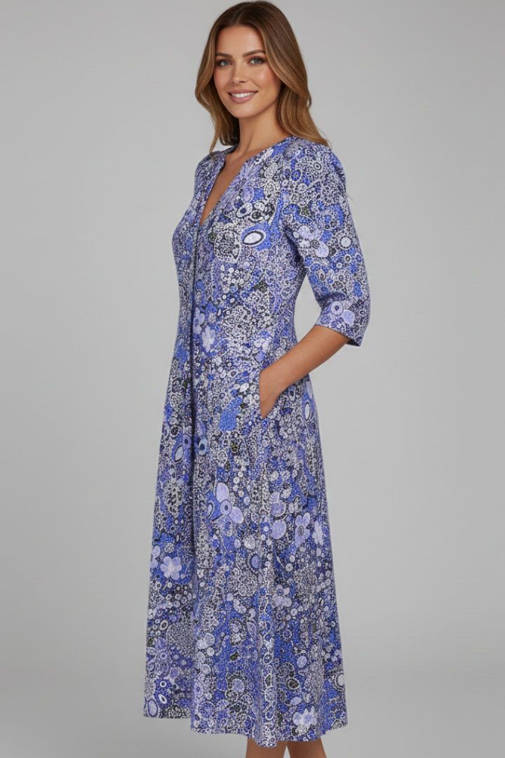 Chic women's V-neck midi dress in a vibrant print with comfortable 3/4 sleeves, suitable for casual elegance.