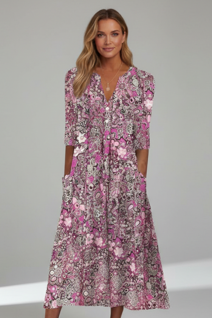 Elegant women's printed midi dress with a flattering V-neck and three-quarter sleeves, perfect for summer events.