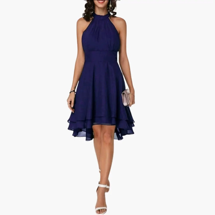 Women's flattering ruffle sleeveless dress, elegant knee-length design with a classic round neck.