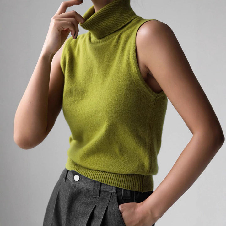 Fitted women's knit top with high mock neck, a stylish layering piece for all seasons.