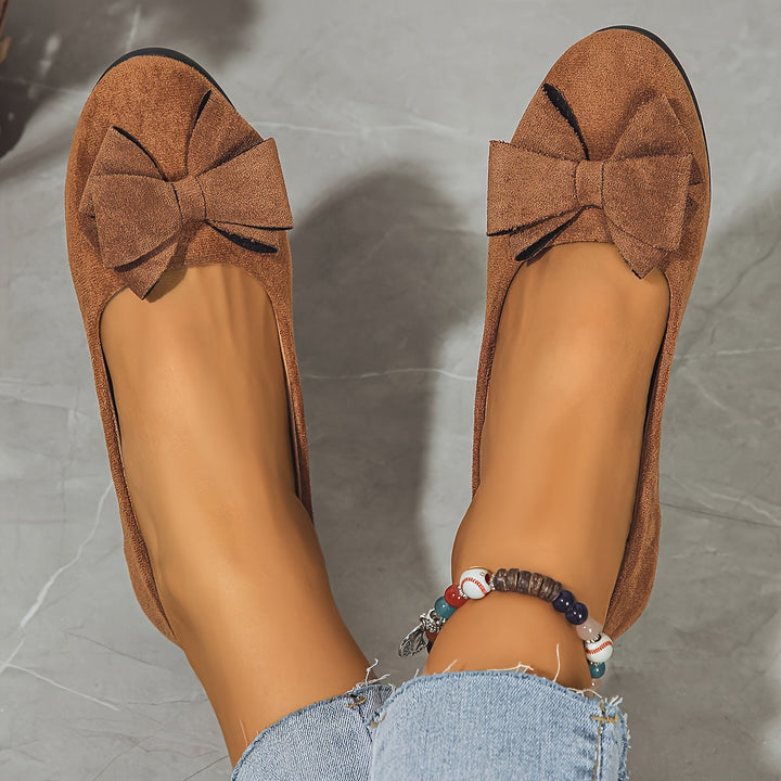 Comfortable women's slip-on wedge shoes. Elegant design with a beautiful bow, perfect for any outfit.