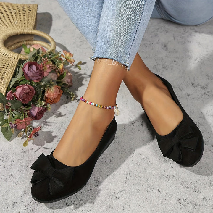 Stylish women's wedge shoes. Slip-on design with a pretty bow. Comfortable & versatile footwear.