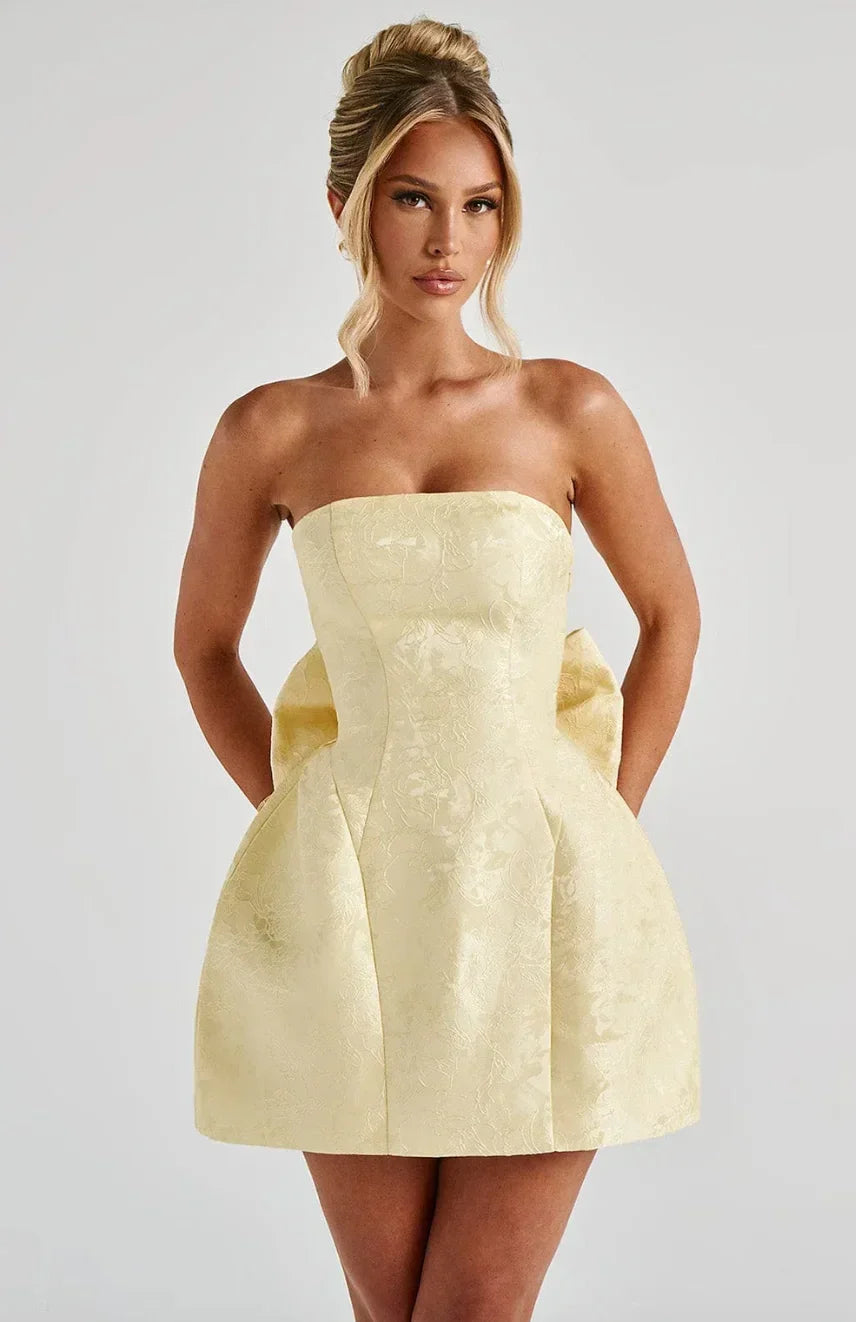 Women's elegant strapless mini dress with a chic bow back, perfect for parties & special occasions.