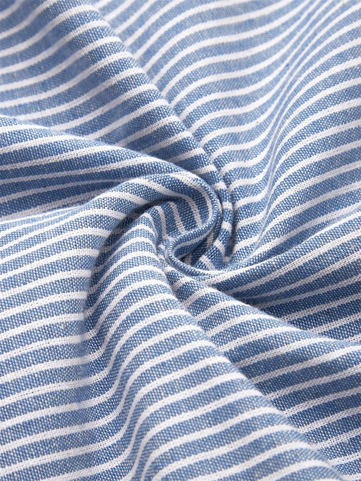 Classic women's striped midi dress featuring elegant button details. Comfortable 3/4 sleeve for all-day wear.