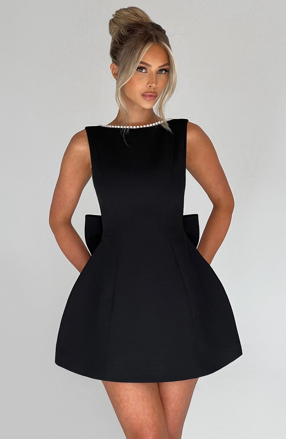 Pink elegant mini dress for women, sleeveless, perfect party or cocktail dress with a structured look.