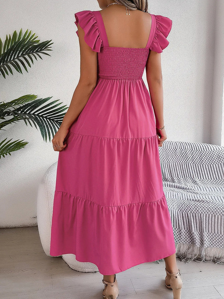 Beautiful women's tiered midi dress, elegant and flowy, with smocked detail and stylish ruffle sleeves.