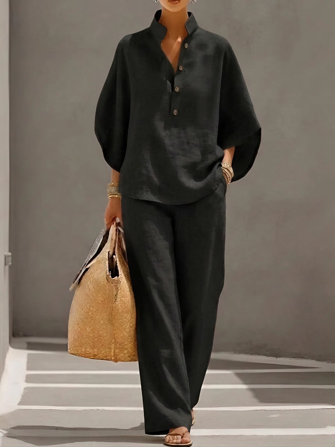 Stylish women's two-piece set: Kimono sleeve top and wide leg pants, embodying casual elegance.