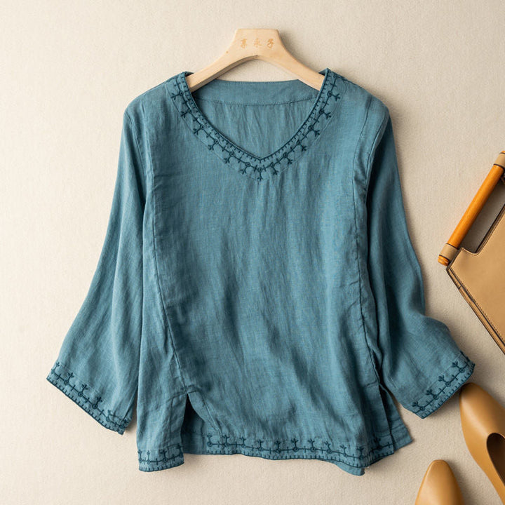Chic women's patterned V-neck blouse, short sleeve. Elegant casual embroidered top for versatile spring/summer style.