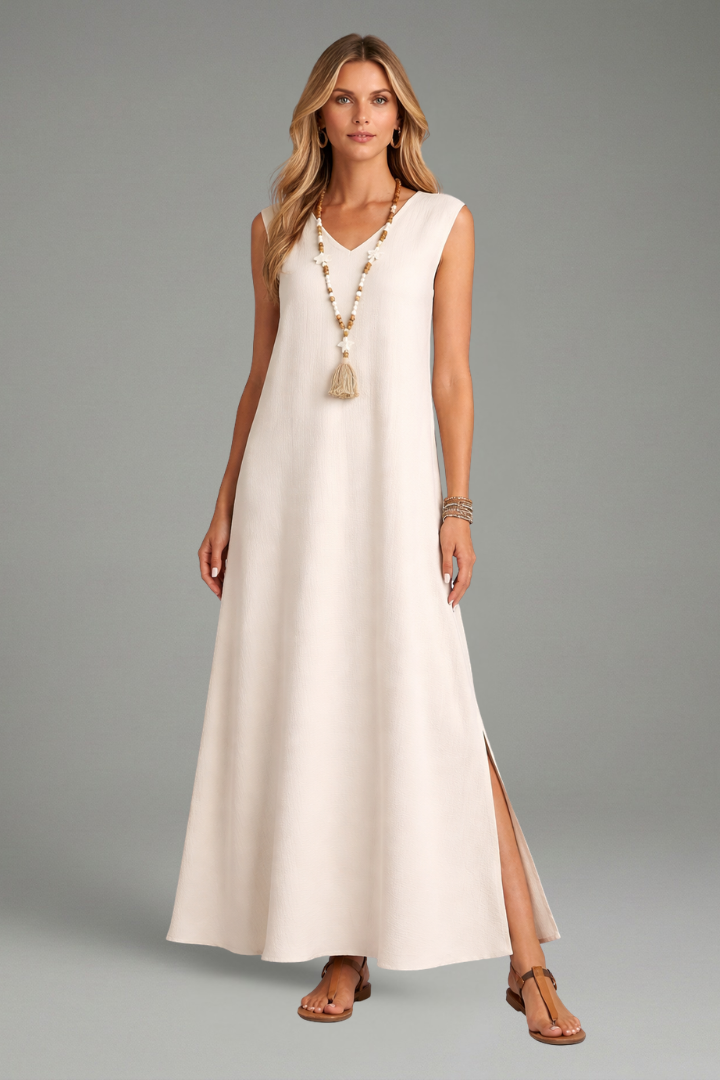 Full-length women's maxi dress in soft fabric, highlighting its elegant V-neck, sleeveless design & side slit.