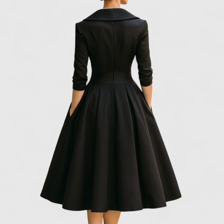 Casual or evening women's V-neck midi dress, with 3/4 sleeves and a flattering, elegant design.