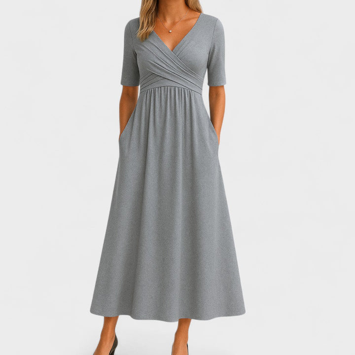 Women's elegant V-neck midi dress with short sleeves, perfect for occasions and parties. Flattering fashion.