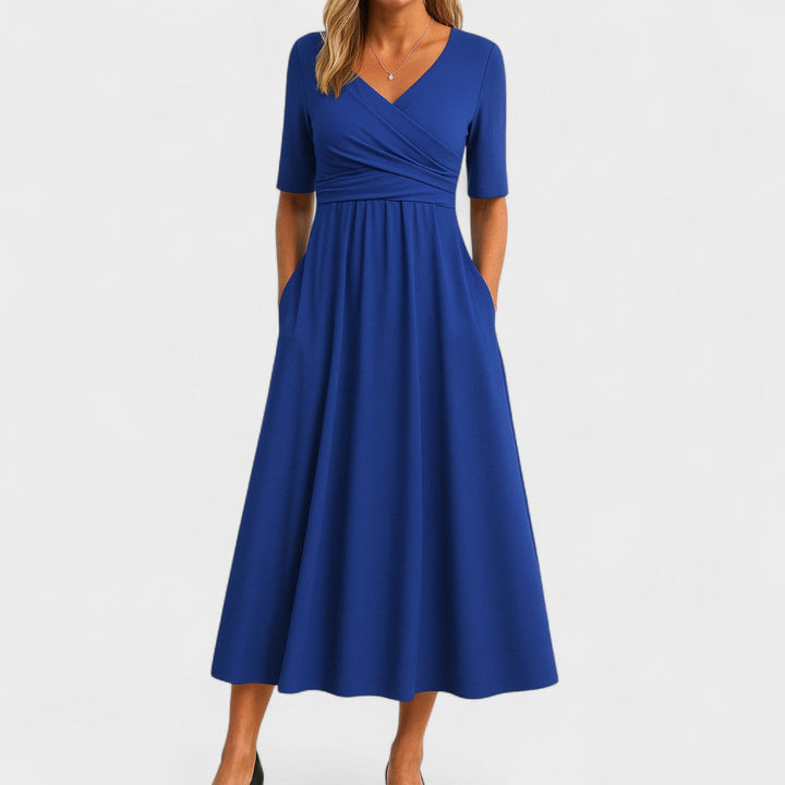 Stylish women's summer midi dress, featuring a chic V-neck and short sleeves. Perfect for elegant occasions.