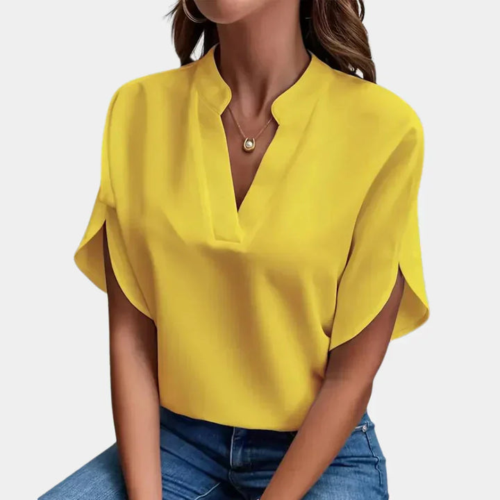 Women's Ella summer blouse, an airy, short sleeve, round neck top perfect for vacation or everyday fashion.