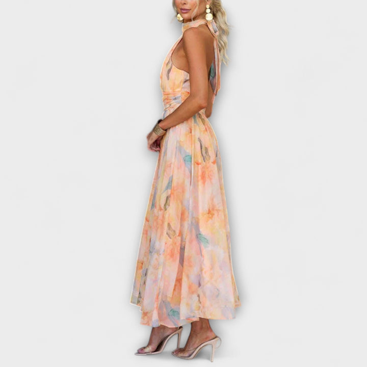 Women's vacation halter maxi dress featuring a beautiful watercolor design, great for resort wear.