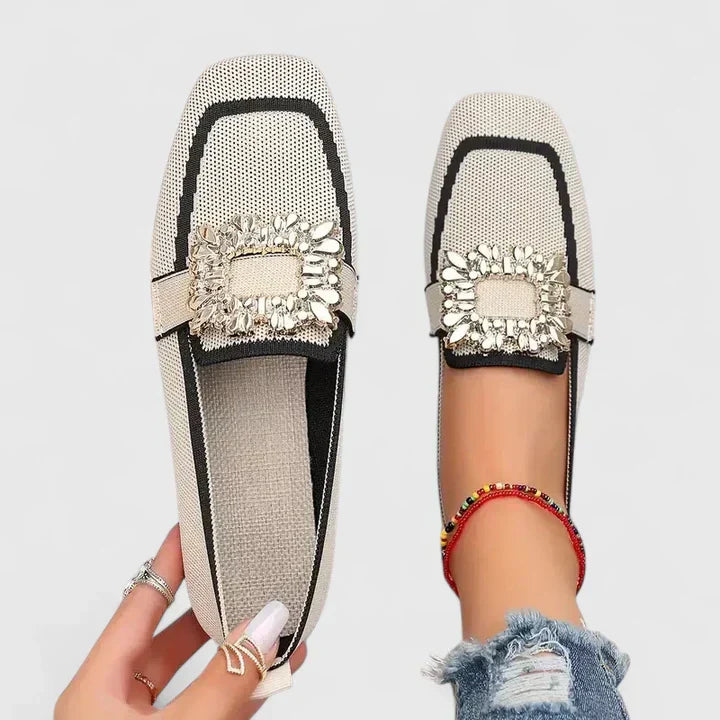 Elegant women's flat slip-on loafers featuring delicate embellishments, perfect for warm weather