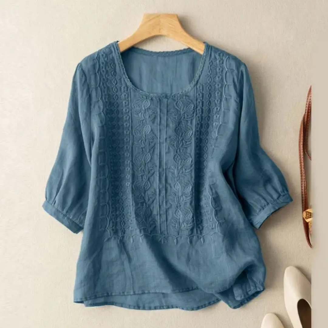Colorful women's 3/4 sleeve blouse, intricate embroidery, and a comfortable relaxed fit for everyday style.