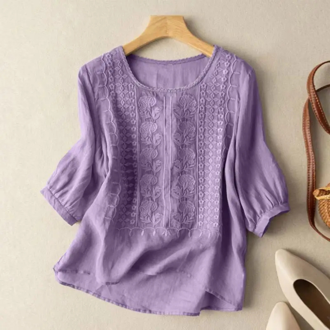 Elegant women's embroidered 3/4 sleeve blouse. Relaxed fit design for versatile spring/summer casual fashion.