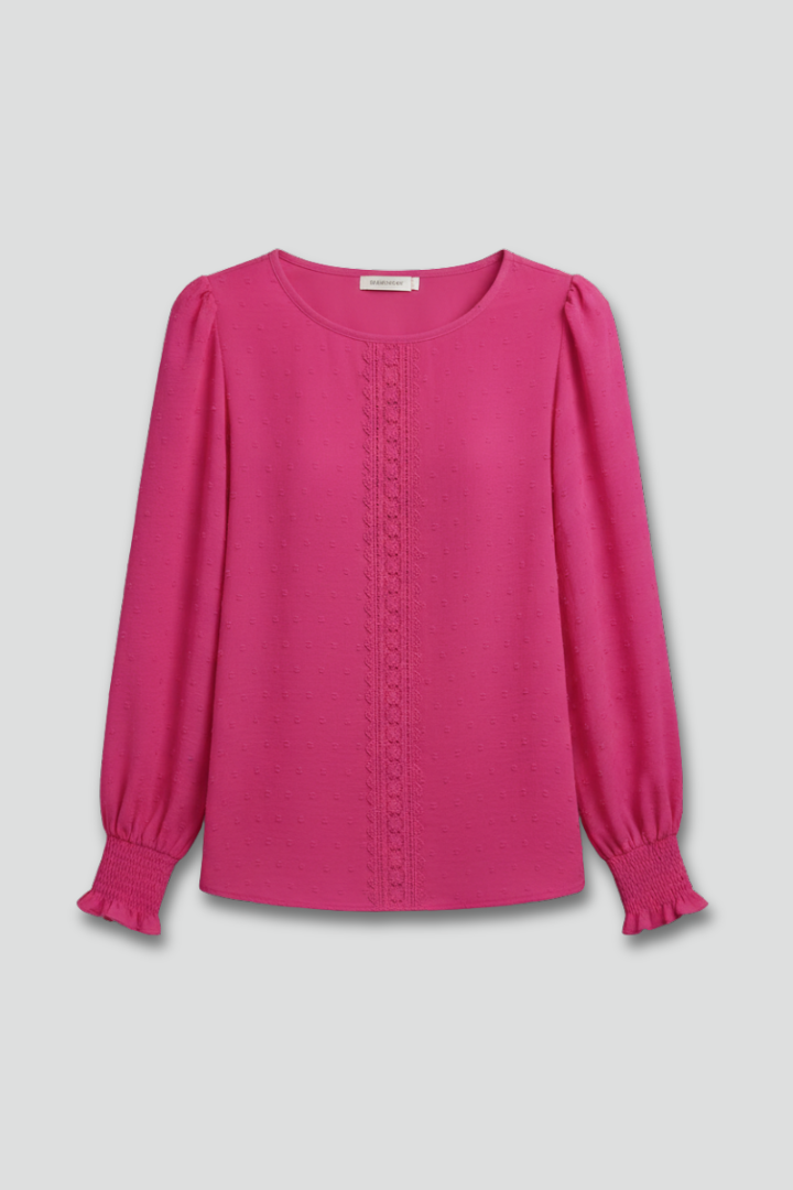 Women's embroidered long sleeve blouse with elegant floral pattern, round neck, and button details. Perfect for spring.