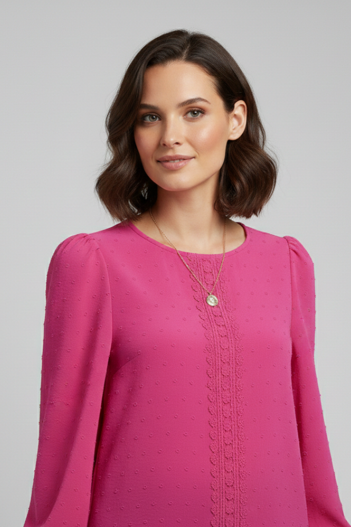 Soft women's embroidered fashion top with long sleeves, round neck, and hip-length design. Suitable for spring and fall.